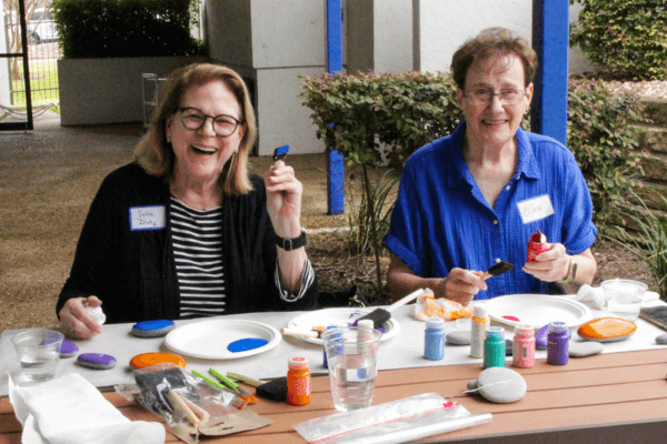 CCCTX volunteers smile while working on a service project.